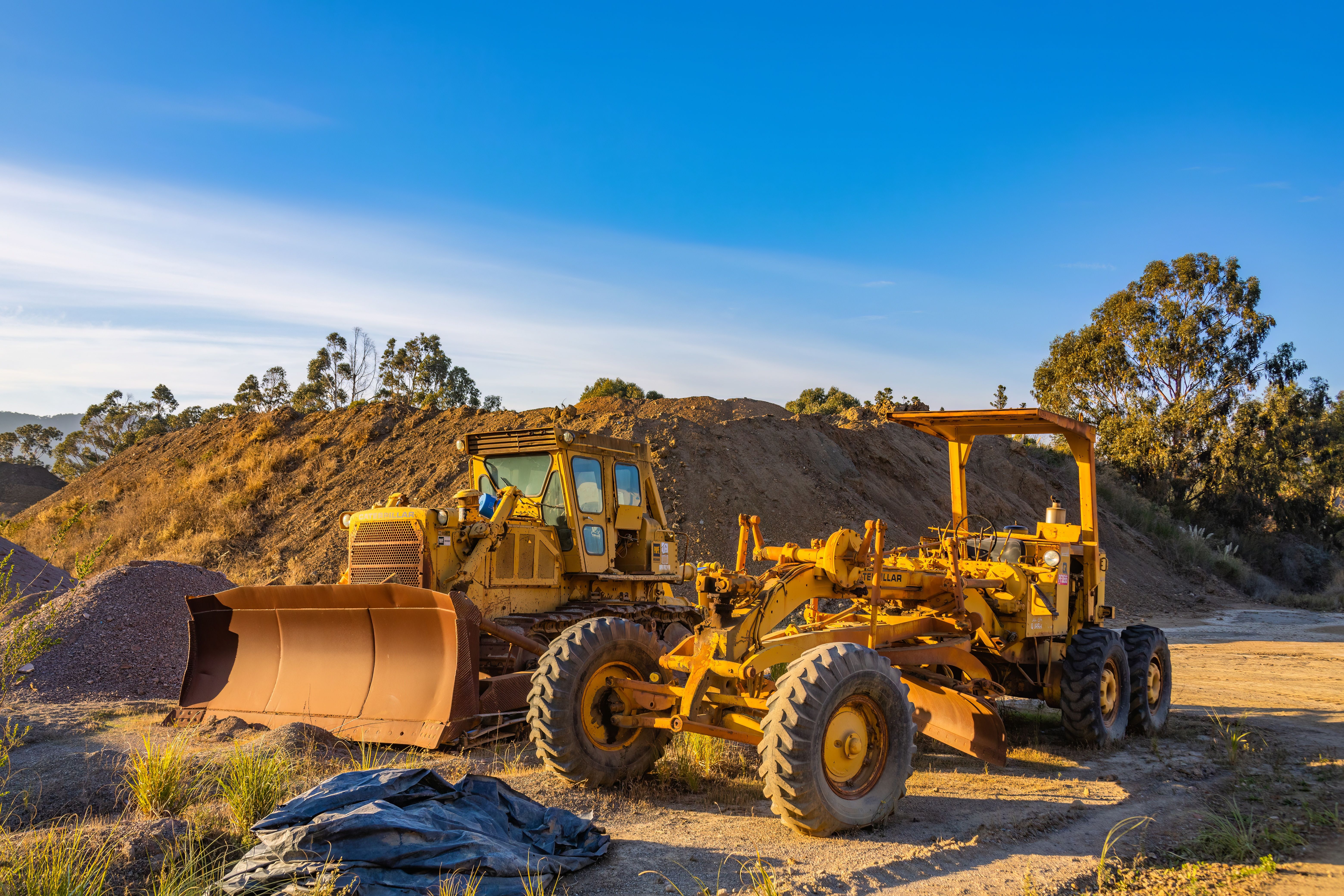 Yellow construction machinery at a worksite